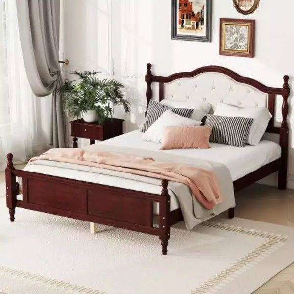 Pine Queen Bed feturing an Upholstered Headboard, Panel Footboard, and Supporting Feet